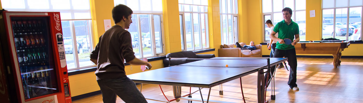Students play ping pong in Residence